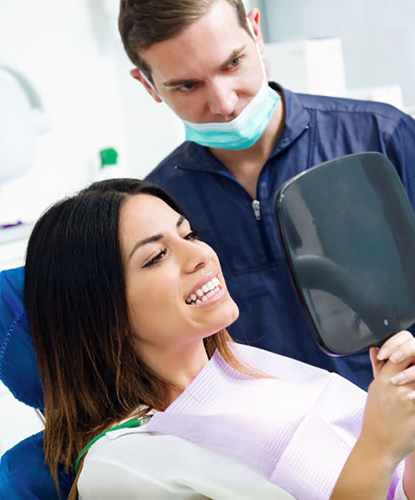 Dental Patient Smiling After The Pinhole Surgical Technique Fixed Her Gum Recession And Saved Her Smile