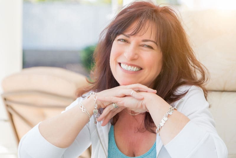 patient smiling after dental implants procedure