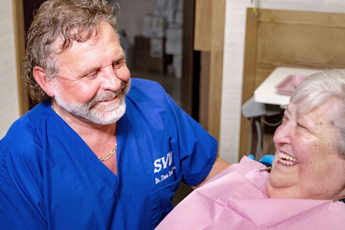 Dr. Saunders Talking About LANAP Laser Gum Disease Treatments To A Dental Patient