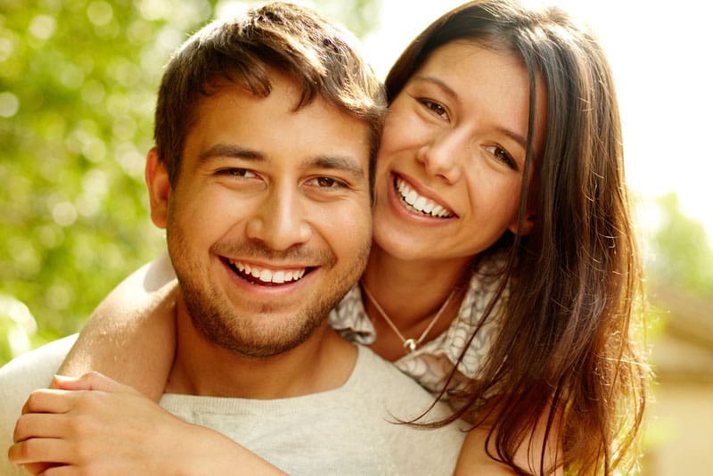 Dental Patients Smiling With Well Cared For Dental Implants In Harrisonburg, VA